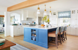 nautical kitchen renovation by mueller homes ivory custom cabinets accented by blue cabinets and custom fabrics and finishes