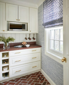 ivory custom cabinets with gold hardware and custom wood countertop in kitchen renovation in annapolis md