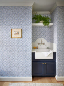 navy Blue cabinets with nautical wallpaper in custom home renovation